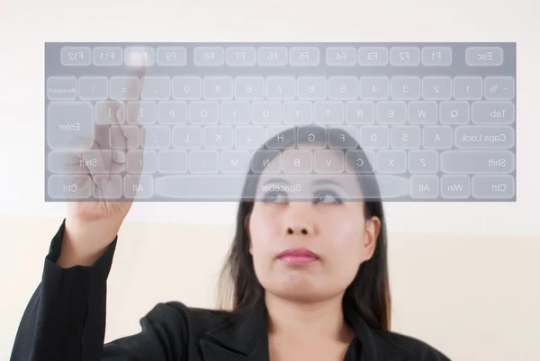 Business lady pushing keyboard on the whiteboard. — Stock Photo, Image