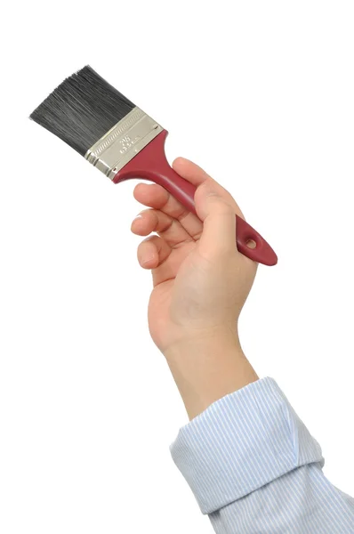 Hand holding paint brush — Stock Photo, Image