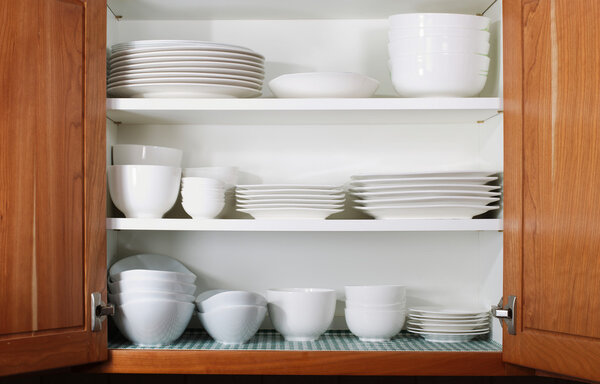 New White Dishes and Bowls in Kitchen Cabinet