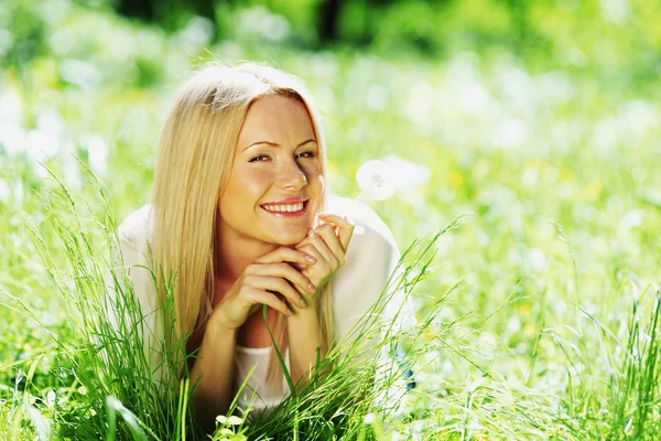 Girl with a dandelion — Stock Photo, Image
