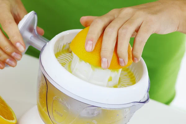 stock image Fitness woman make an orange juice