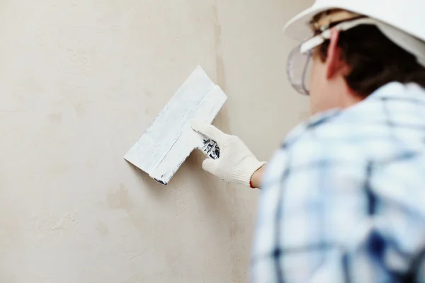 Trabalho alinha com uma parede de espátula — Fotografia de Stock