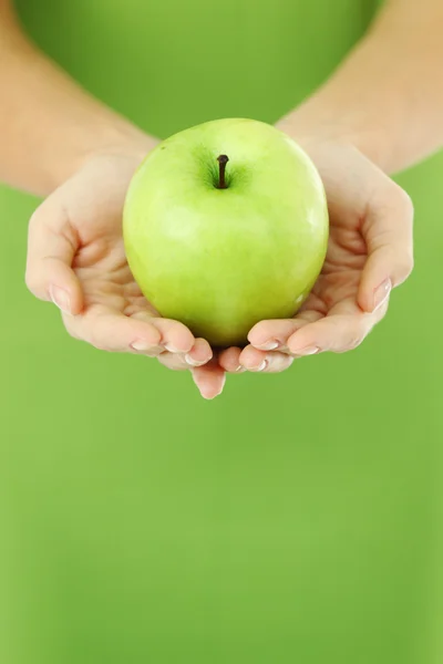 Apple in hands — Stock Photo, Image