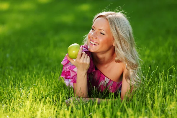 Blonde on green grass — Stock Photo, Image
