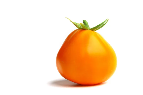 Orange tomato on white — Stock Photo, Image
