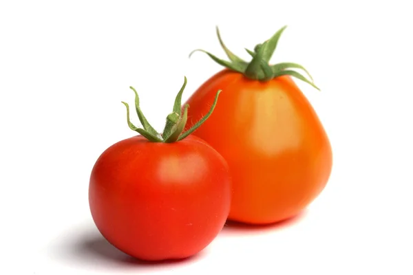 Roter Tomatenstapel auf weißem — Stockfoto