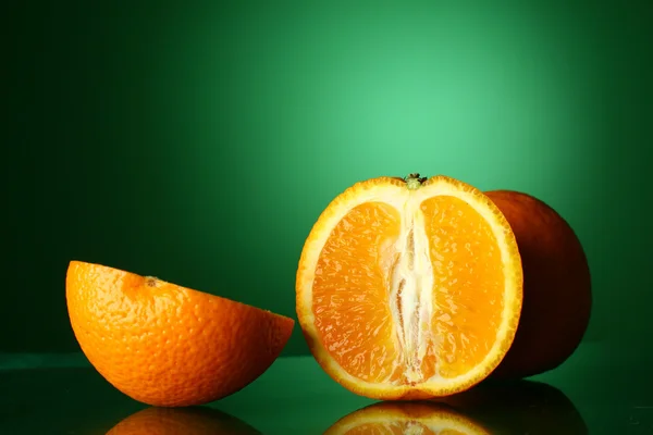 Oranges on green — Stok fotoğraf