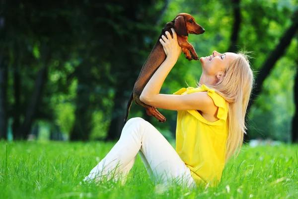Woman dachshund in her arms Royalty Free Stock Photos