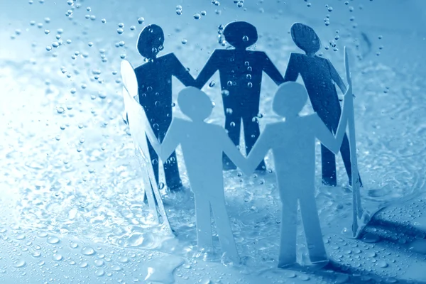 Equipe de papel sob chuva — Fotografia de Stock