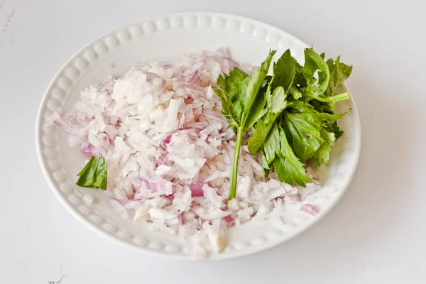Chopped onions and raw parsley — Stock Photo, Image