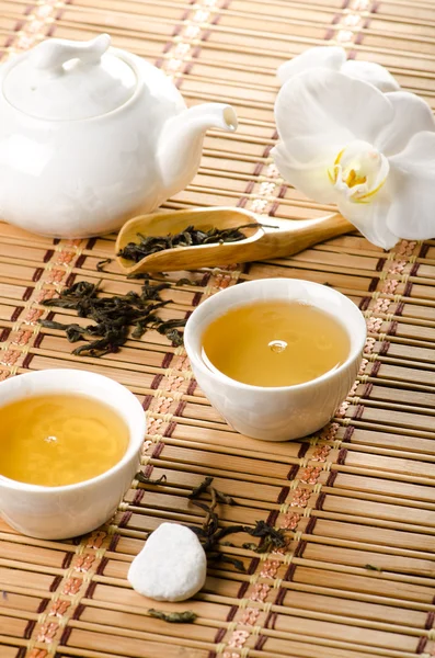 Tea on bamboo Stock Picture