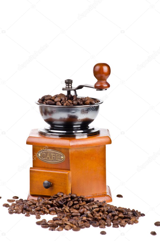 Coffee grinder with coffee beans on isolated white background