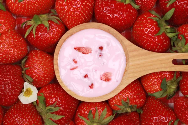 Strawberry yogurt on a spoon — Stock Photo, Image