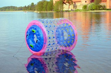 Zorb air bubble on Lake Galve water Trakai Castle clipart