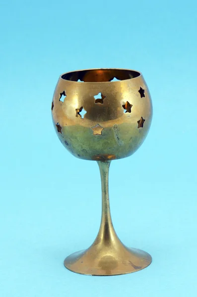 Bronze glass candlestick on blue background — Stock Photo, Image