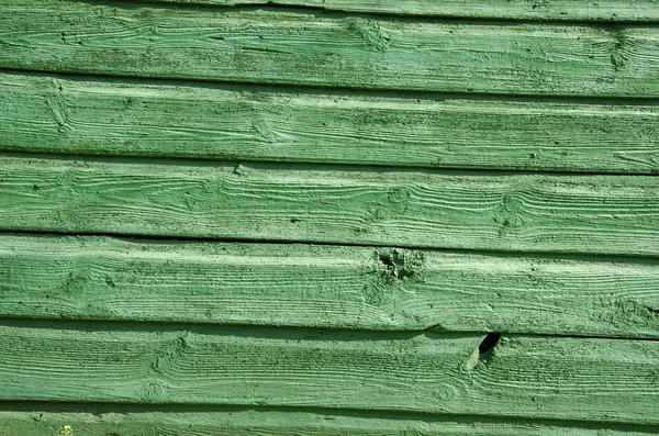 古い木の板壁の背景を緑色に塗った — ストック写真