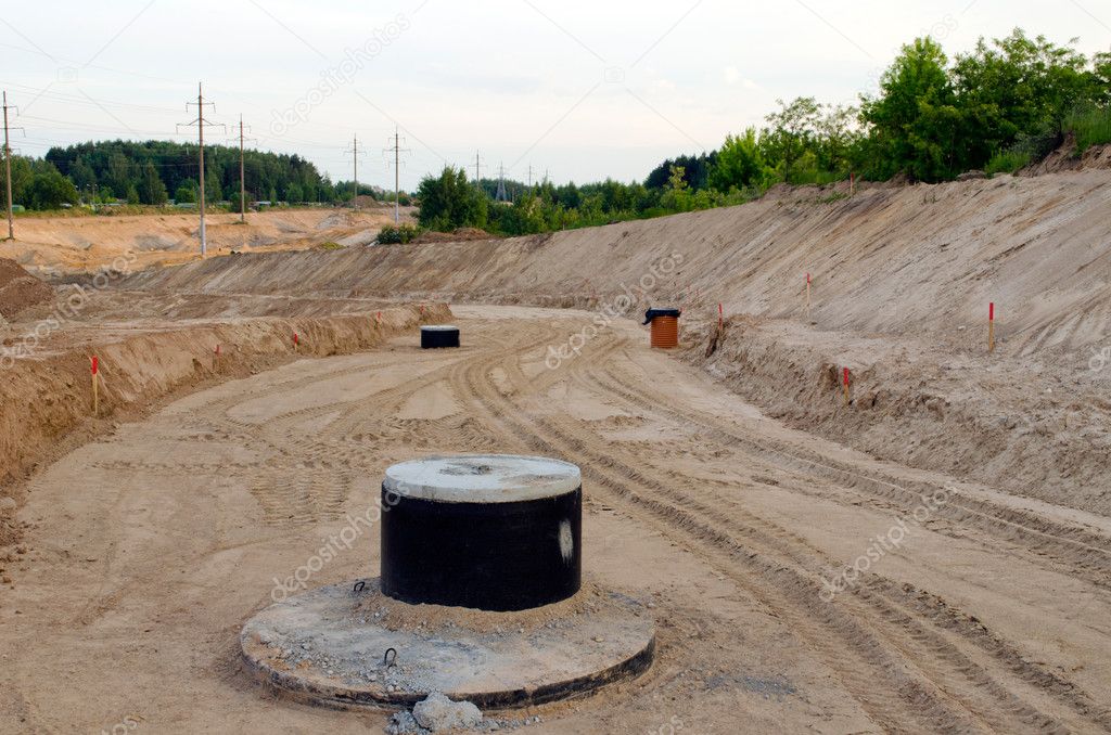 Road construction. Gravel sewage wells