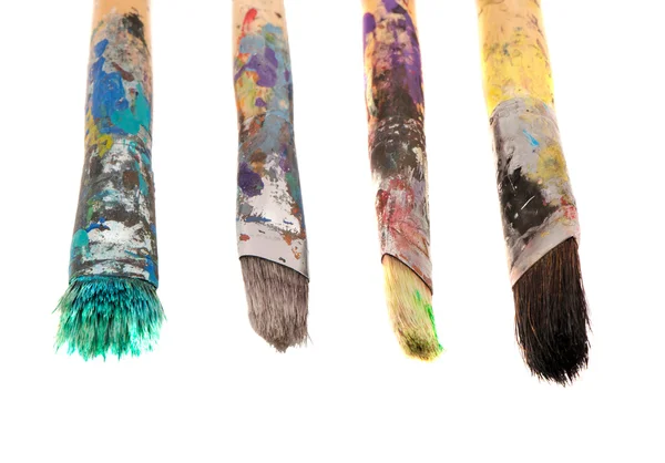 Dirty wooden paint brushes isolated on white — Stock Photo, Image