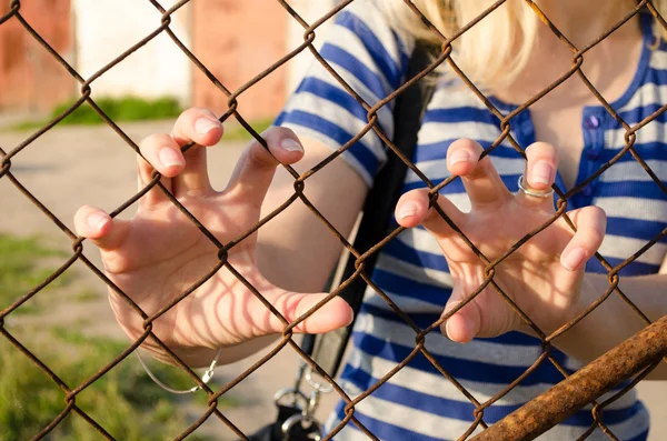 Woman hands claw rusty fence. Human freedom stop — Stock Photo, Image