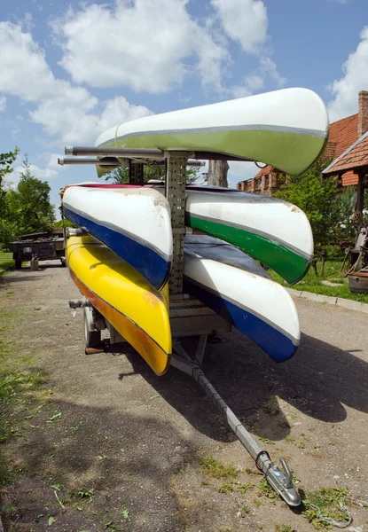 Kayaks canoes loaded on special transport trailer — Stock Photo, Image
