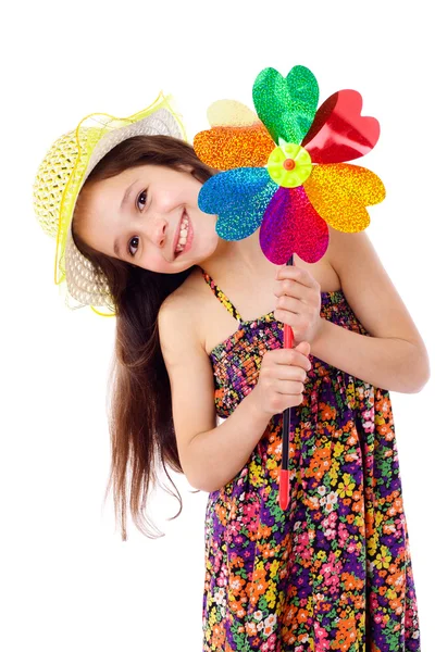 Menina sorridente com moinho de vento — Fotografia de Stock