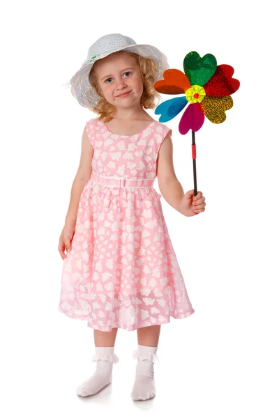 Lächelndes kleines Mädchen mit Windmühle — Stockfoto