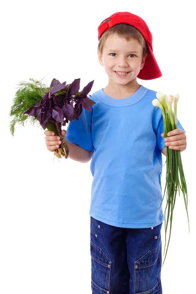 微笑む少年の野菜添え — ストック写真