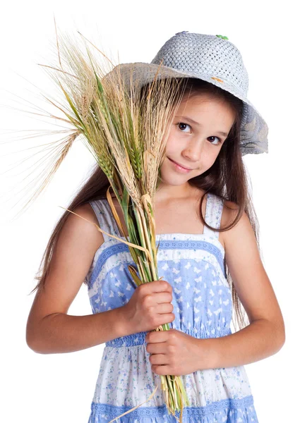 Mooi meisje met eerstelingsgarve van tarwe — Stockfoto