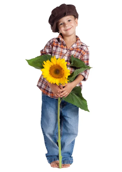 Uśmiechnięty chłopiec ze słonecznikiem — Zdjęcie stockowe