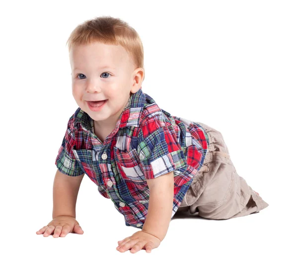 Bambino sorridente che striscia sul pavimento — Foto Stock