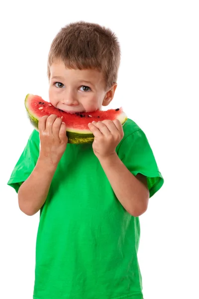 Litle jongen eten een watermeloen — Stockfoto