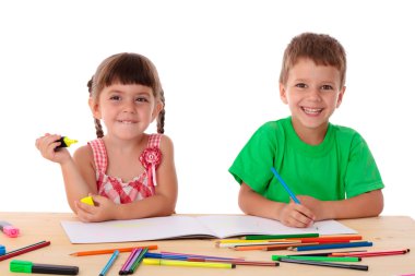 Two little kids draw with crayons clipart