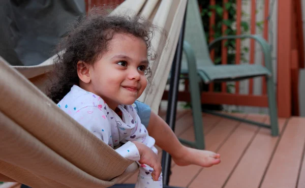 Happy little girl in hammock — Stock Photo, Image