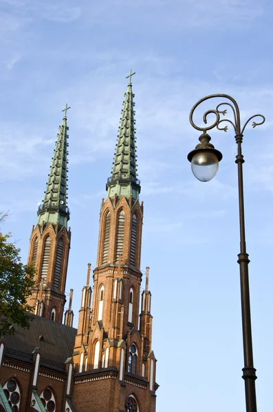Church towers and street lamp in Warsaw — Stock Photo, Image