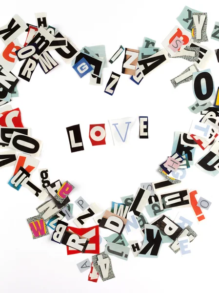 Liefde inscriptie gemaakt met uitgesneden letters — Stockfoto