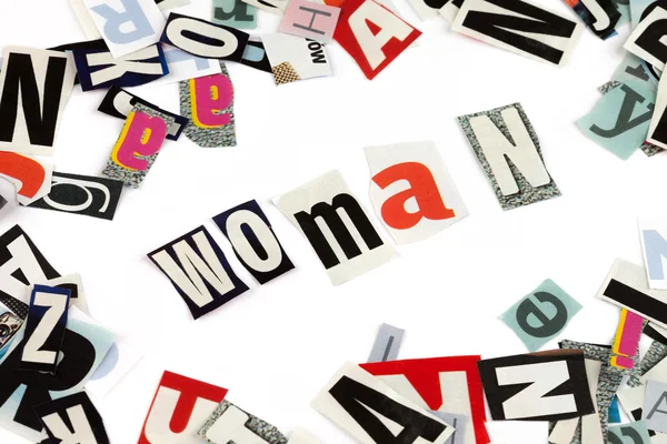 Woman inscription made with cut out letters — Stock Photo, Image