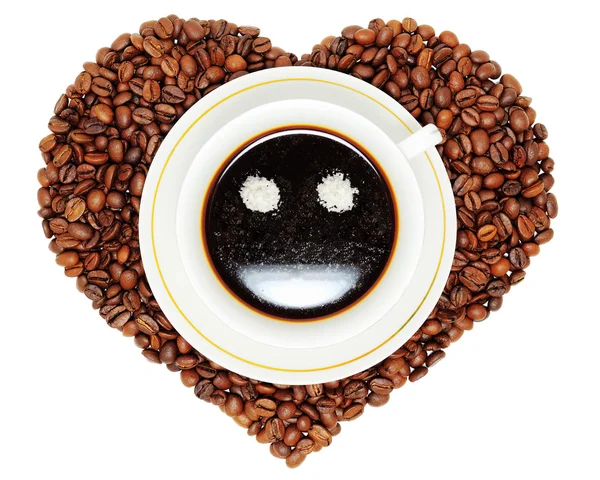 Taza de café en el corazón de granos de café Imagen De Stock