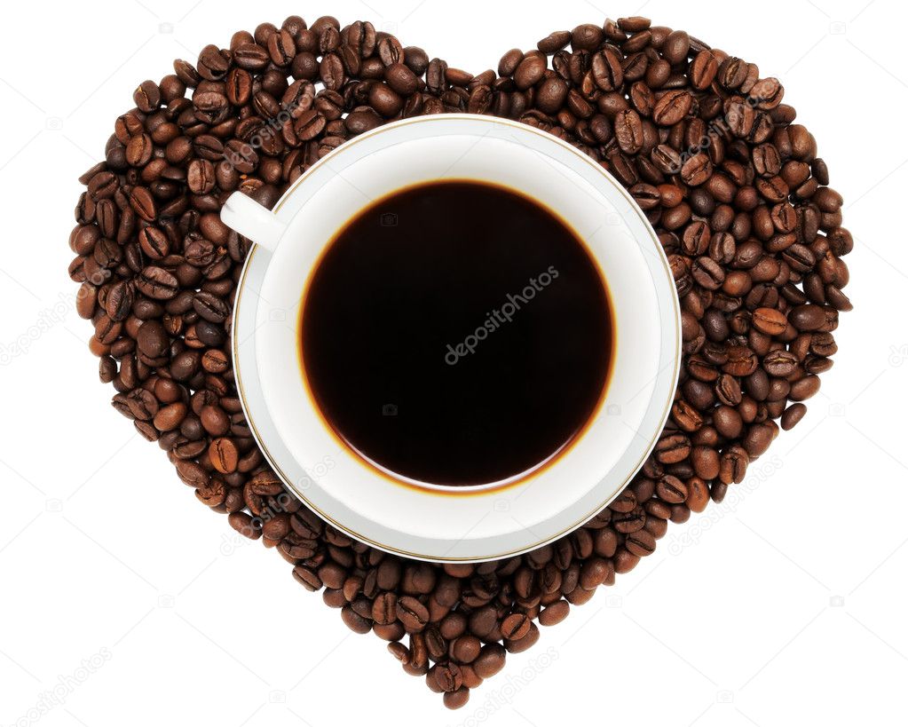 Coffee cup on heart from beans of coffee