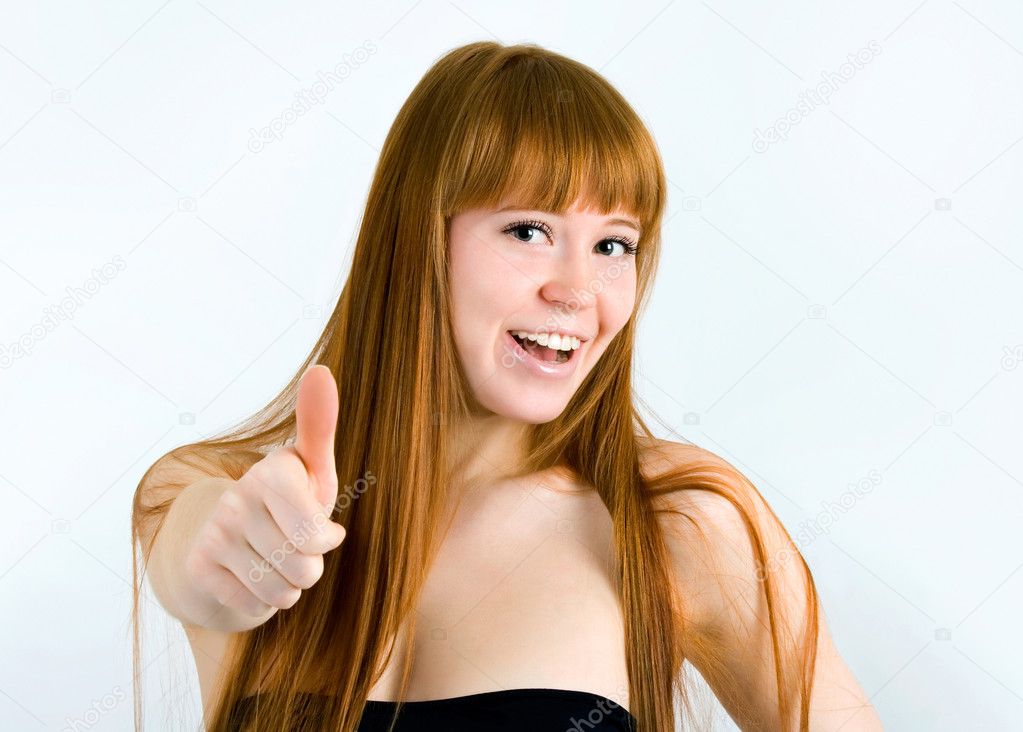 Beautiful young red-haired woman with long beauty straight hair.