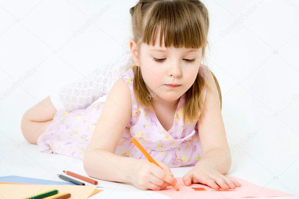Cute child draw with colorful crayons and smile, isolated over w