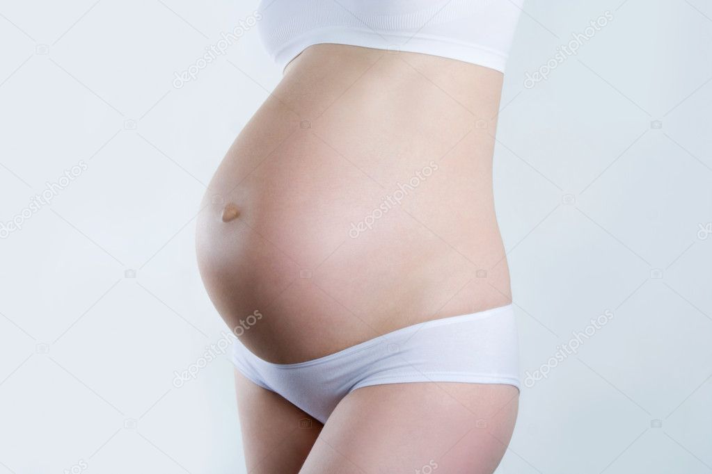 A silhouette of a beautiful pregnant woman