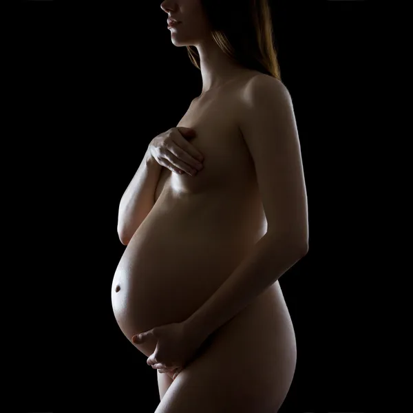 Une silhouette d'une belle femme enceinte — Photo