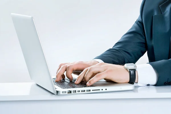 stock image Close-up of male hands typing on laptop keyboard