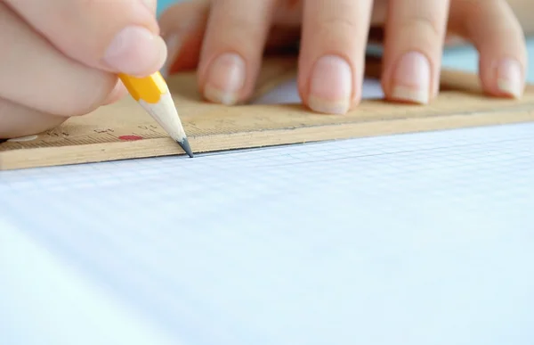 Hand, a pencil and ruler — Stock Photo, Image