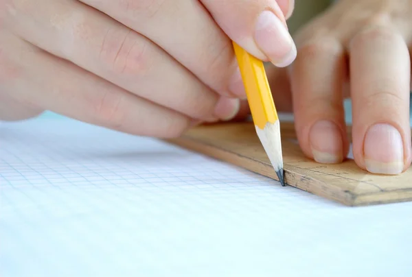 Hand, a pencil and ruler — Stock Photo, Image