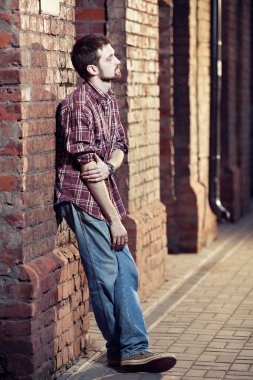 Young man waiting for someone clipart