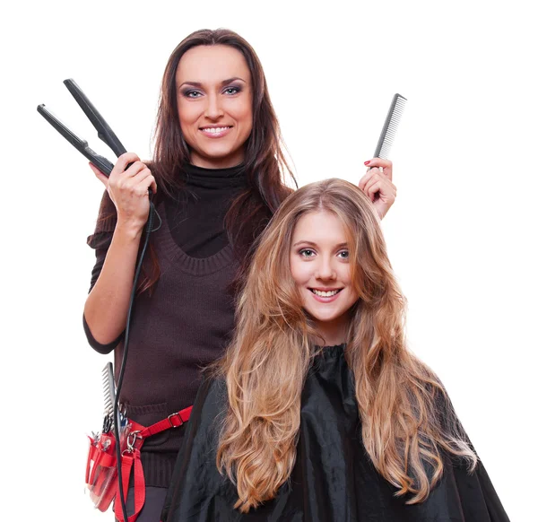 Estúdio tiro de cabeleireiro sorridente com alisadores — Fotografia de Stock