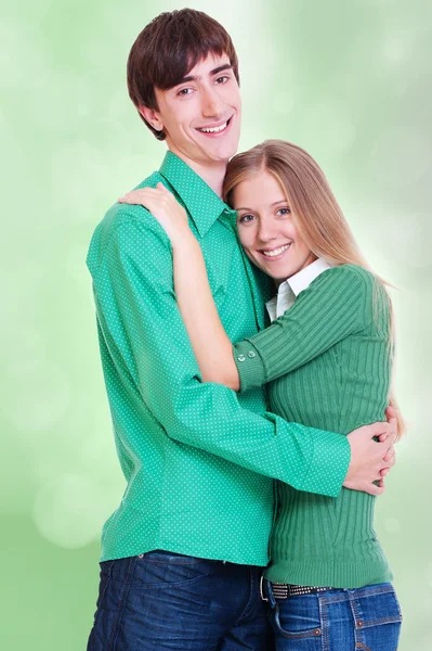 Smiley couple over green — Stock Photo, Image