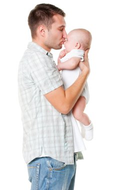 Father holding his son and kissing him clipart