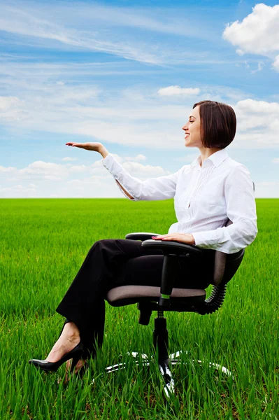 Beautiful businesswoman sitting on recliner — Stock Photo, Image